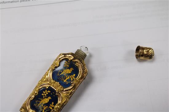 An early 20th century continental gold overlaid enamelled glass scent bottle, 75mm.